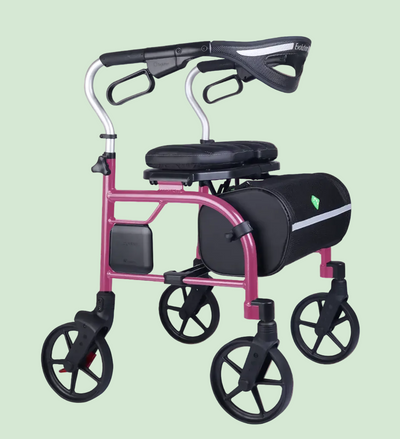 A pink and black rolling walker with a seat, armrests, and a side storage bag, shown on a white background.