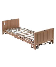 Drive full electric low-height hospital bed shown flat with side rails and adjustable head and foot sections for home care