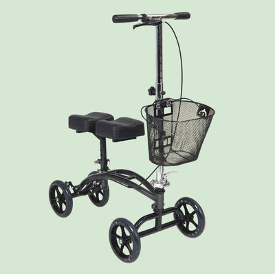 Black knee scooter with wheels and basket on a white background