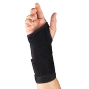 Black wrist brace with dual velcro straps and rigid palmar splint worn on right hand — side view showing full wrist and lower forearm coverage for carpal tunnel support and wrist immobilization