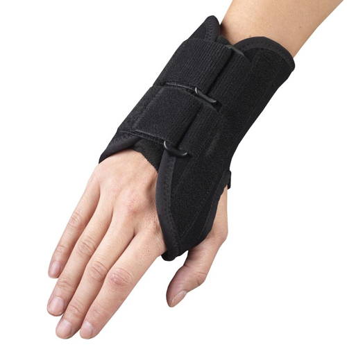 Black lace-up wrist brace with thumb loop, palmar splint, and hook-and-loop closure worn on left hand — top angled view showing open-finger design, structured wrist support, and secure fit for carpal tunnel and wrist strain