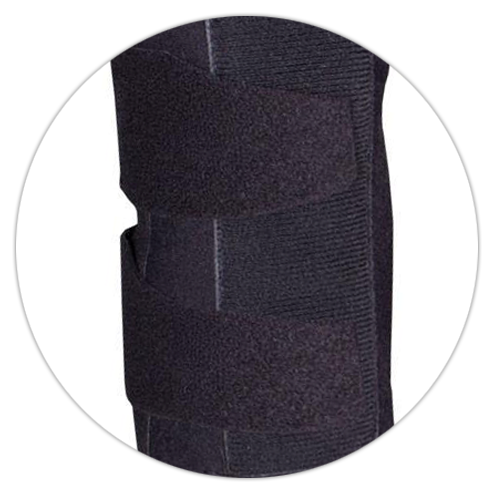 Closeup detail of black wrist splint showing textured neoprene fabric, rigid metal palmar stay channel, and hook-and-loop velcro closure — circular crop highlighting structured support material and splint construction