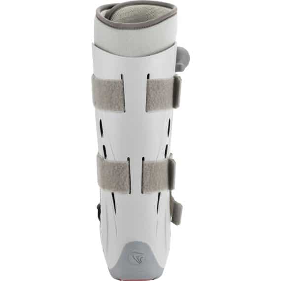 Breg Genesis Full Shell Pneumatic Walking Boot – rear view showing white ventilated hard shell with cutout panels, three grey hook-and-loop straps, padded foam cuff at top, side air pump bulb, and grey rubber base on white background