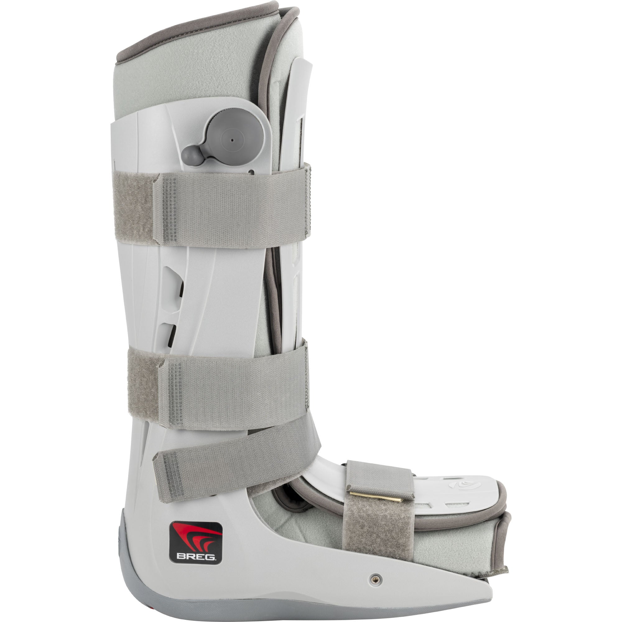 Breg Genesis Full Shell Pneumatic Walking Boot – white hard-shell walker with grey foam padding, four hook-and-loop straps, built-in air pump bulb, and scalloped rubber outsole, shown in side profile on white background