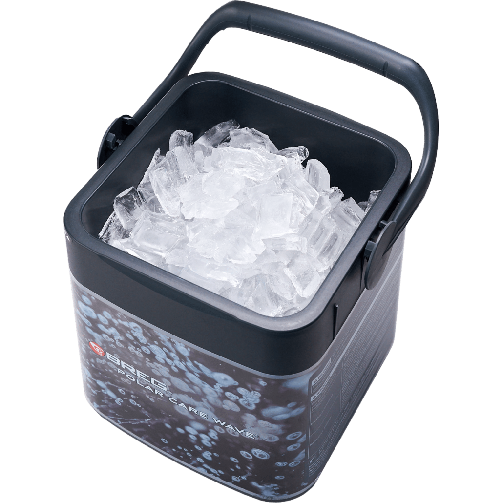 Breg Polar Care Wave cold therapy reservoir tank open and filled with crushed ice, showing large ice capacity and carry handle
