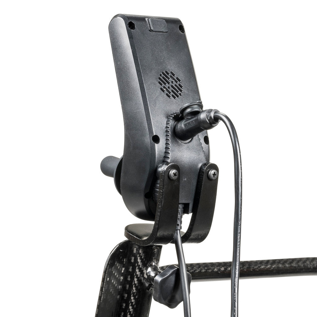 Close-up of Carbon Touch electric wheelchair joystick controller back showing swivel mount bracket, cable connection, ventilation grille, and carbon fiber armrest tube