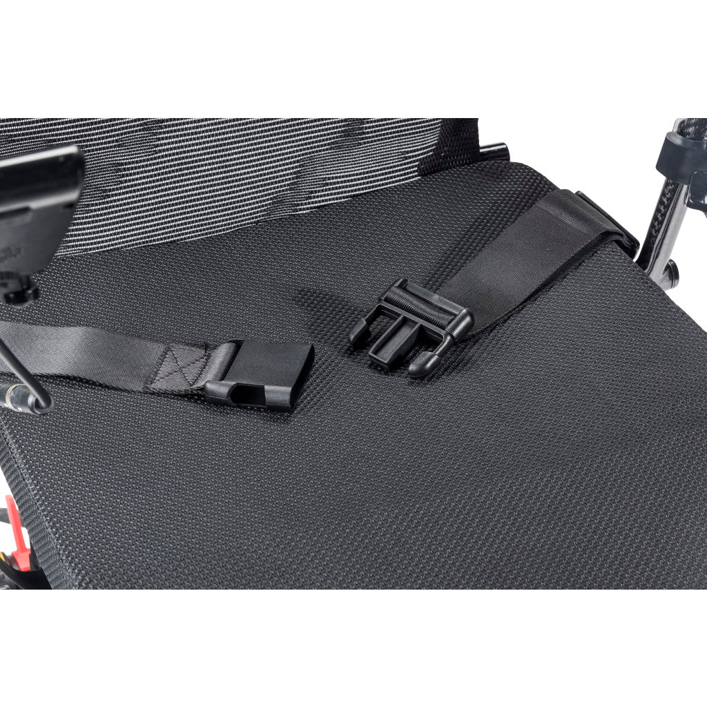 Close-up of Carbon Touch electric wheelchair padded mesh seat showing two quick-release safety belt buckles and carbon fiber armrest tube