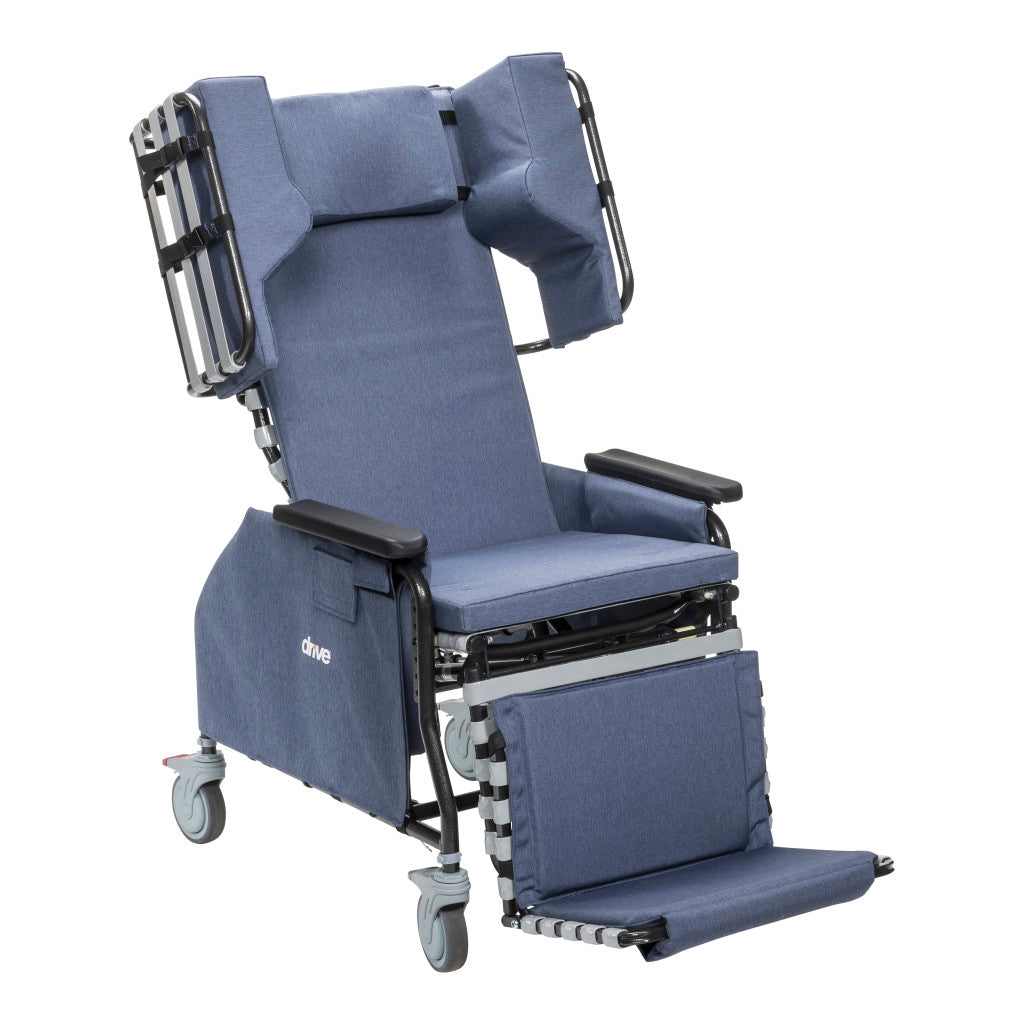 Drive tilt-and-recline chair in upright position with open lateral headrest supports, padded armrests, seat cushion, leg rest, and casters in blue upholstery — available at Must in Metro Vancouver
