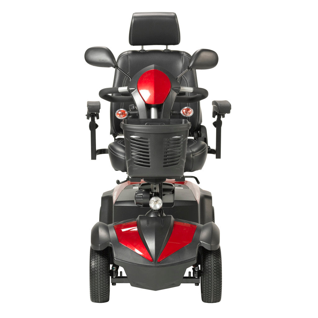 Front view of Drive Ventura 4-wheel mobility scooter in red and black showing delta tiller, dual mirrors, turn signals, headlight, front basket, and captain seat with headrest
