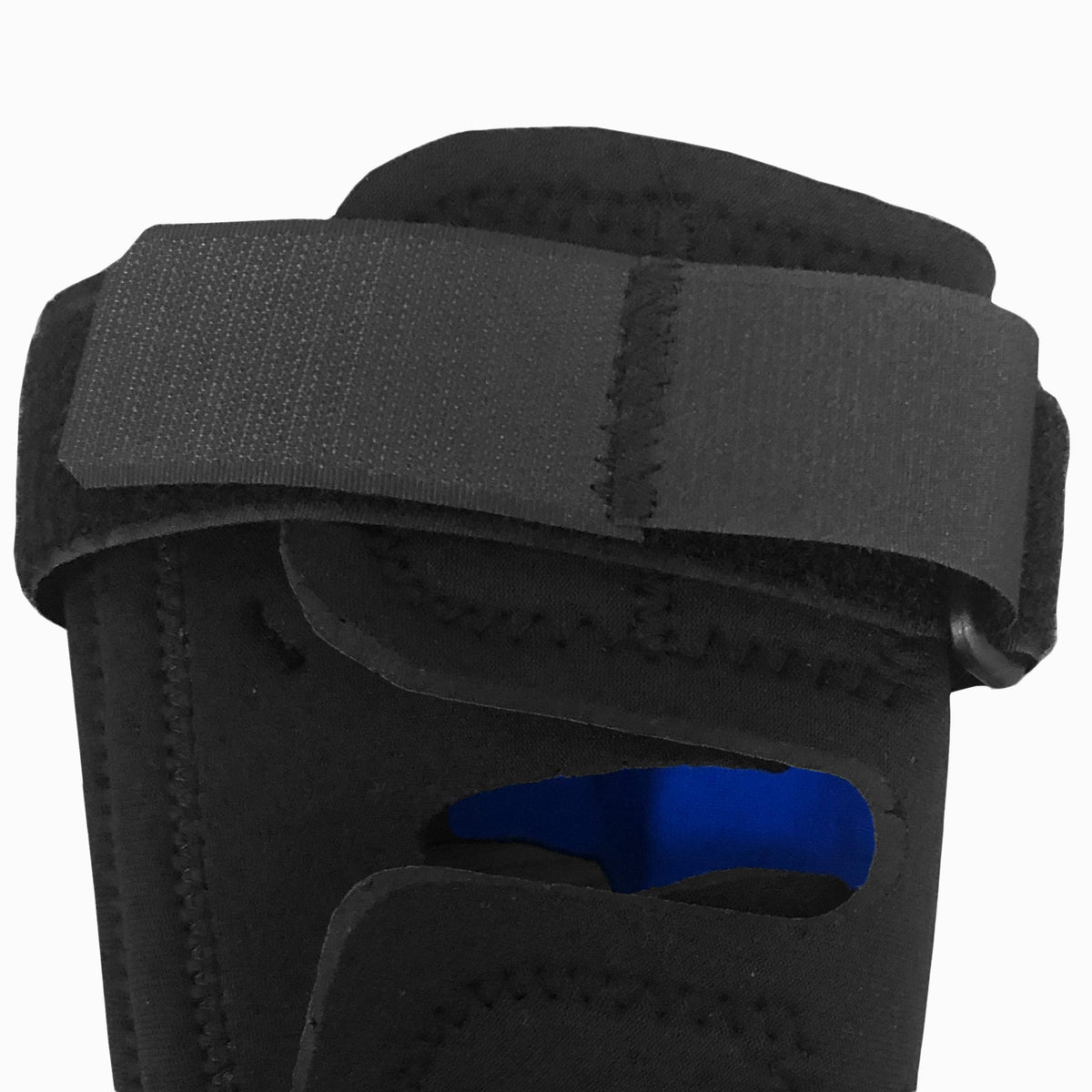Close-up of OTC KidsLine 0324 pediatric knee wrap showing adjustable velcro encircling strap and blue flexible lateral stay – Must