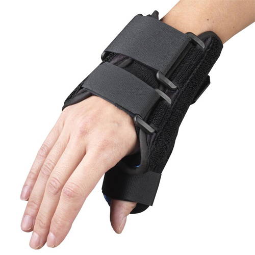 Top-down palm view of OTC 2387 wrist-thumb splint on right hand showing rigid dorsal shell, two D-ring buckle straps, thumb spica channel, and open finger design
