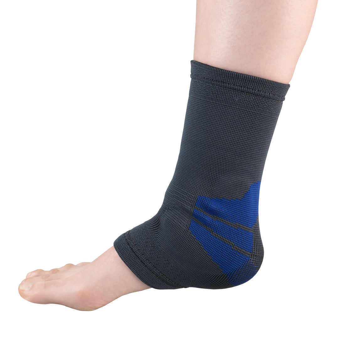OTC 2437 compression ankle brace with gel pads worn on foot and ankle, medial side view showing charcoal grey knit sleeve with blue X-shaped gel pad reinforcement over lateral malleolus and heel
