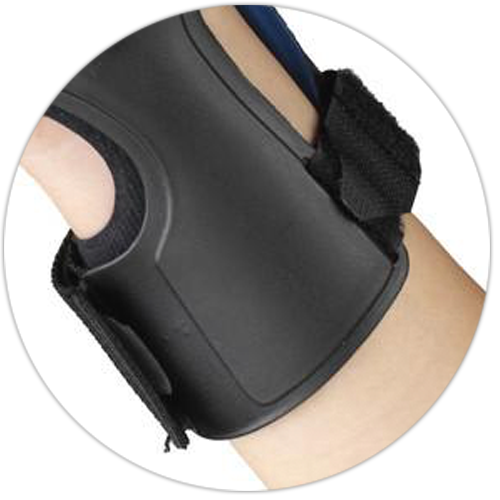 Close-up underside view of OTC Exolite wrist brace showing molded exoskeleton shell, blue lateral stay, velcro closure strap, and padded interior lining
