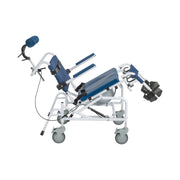 Tilting aluminum rehab shower commode chair side view in fully reclined position with padded headrest, blue seat cushion, adjustable leg rests, foot supports, and locking casters — available at Must in Metro Vancouver